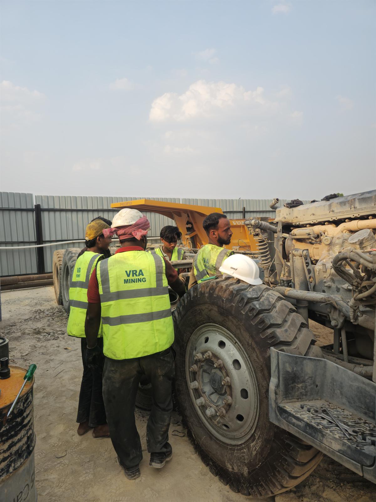 Before and after of a Volvo dump truck accident repair and restoration