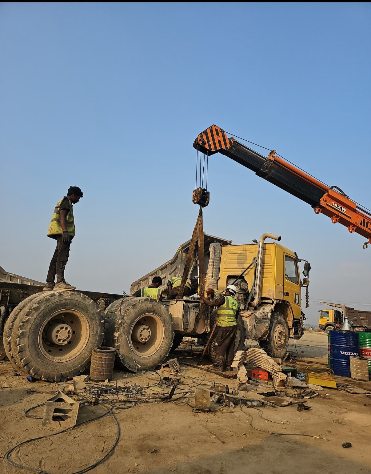 VRA technicians using a mobile crane to lift a Volvo tipper body during on-site accident repair